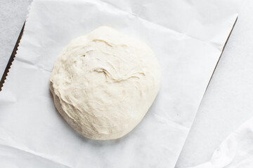Overhead view of bread dough rising, top view of proofing dough, process of making artisan bread