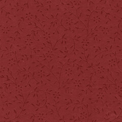 Embossed red floral paper texture with subtle vine patterns, ideal for stationery, packaging design, decorative backgrounds, and print crafts.