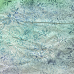 Distressed watercolor floral texture in green and blue tones, great for artistic backgrounds, scrapbooking, mixed media, and vintage-inspired designs.
