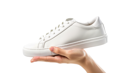Woman hand holding white sneaker on transparent background