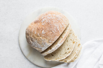 Overhead view of sliced homemade artisan bread, top view of baked sourdough artisan bread slices