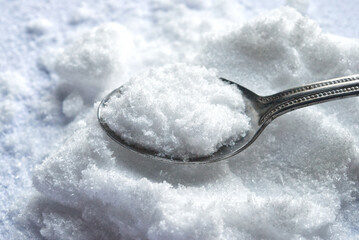 Close up of taurine powder on spoon.Taurine is an amino acid found in many foods, especially meat and fish. It supports heart health, muscle function, and energy production. 