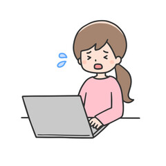 困った表情でパソコンを操作する女性