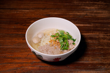 Delicious local noodle soup street vendor food dish cozy setting close-up culinary experience