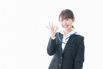 OKサインを示す笑顔のビジネスウーマン