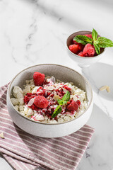 cottage cheese with raspberries and almond petals