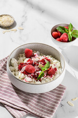 cottage cheese with raspberries and almond petals