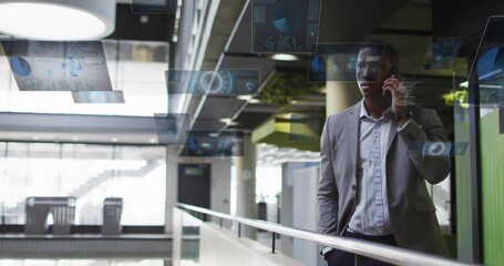 Businessman talking on phone with digital data animations floating around him - Powered by Adobe