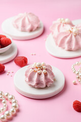 berry marshmallows on a pink background