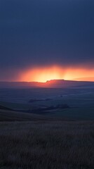 Fototapeta premium Dramatic sunset over a vast, flat landscape.