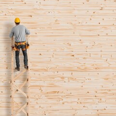 A worker in a yellow hard hat climbs a ladder against a plain wooden wall, showcasing craftsmanship and construction work.