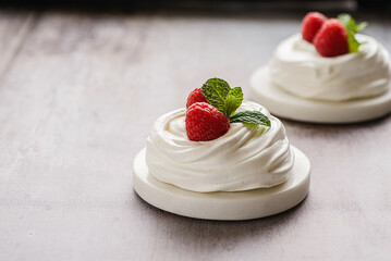 pavlova meringue dessert with raspberries and cream