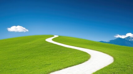 Obraz premium A winding white path leads through vibrant green hills under a clear blue sky, creating a serene landscape.