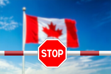 Flag of Canada and Stop sign at the Canadian border