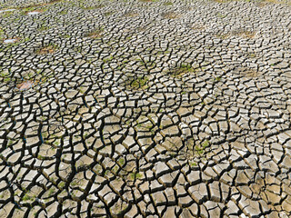 Dry and cracked ground land. Global warming and climate change. Environmental pollution by chemical waste.