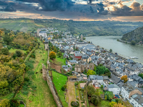 Aerial view of Oberwesel medieval city walls restored Gothic gate tower, drawbridge and church along the Rhine river in Germany