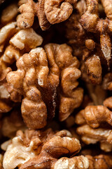 organic raw walnuts in a wooden bowl
