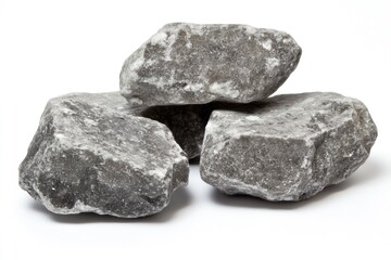 Gray stone aggregates.  Three irregular-shaped, gray stones stacked on a white background.  They exhibit varied textures and shades of gray.  Natural, rough-hewn appearance