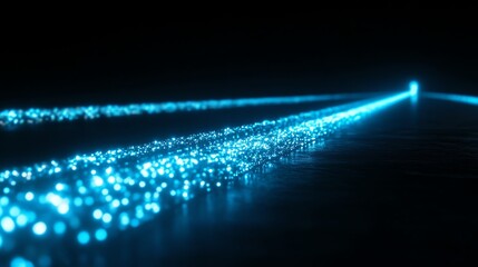Obraz premium Glowing Blue Light Streaks Forming Path on Dark Reflective Surface