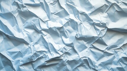 Obraz premium Close-up of crumpled light blue paper texture. Ideal for backgrounds, design projects, and adding a textured aesthetic.