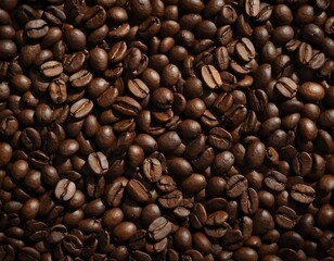 Fototapeta premium Scattered coffee beans on a neutral surface. Warm lighting enhances texture and rich brown tones, creating a cozy and inviting aesthetic.