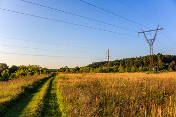 Country road going under high-voltage power line