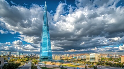 Modern skyscraper against dramatic sky