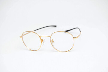 A pair of glasses sitting on top of a white surface