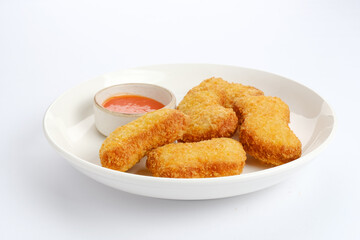Raw fried chicken nuggets on food container, frozen food preparation 

