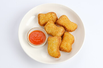 Raw fried chicken nuggets on food container, frozen food preparation 
