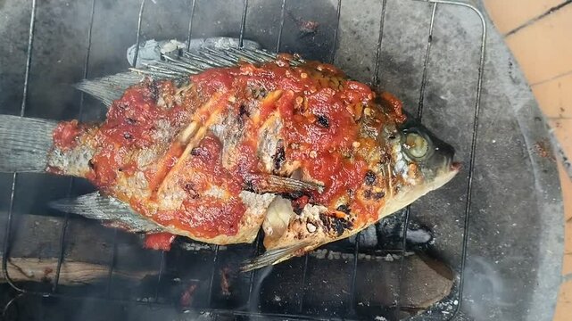 Tilapia fish (Oreochromis mossambicus) grilled with spicy spices