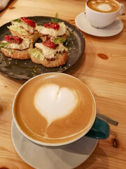 A cup of aromatic coffee with a delicate and delicious dessert