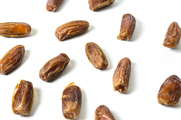 Close up view of kurma tunisia or sweet dried dates palm fruits. Dates fruit isolated on white background. Clipping path. High angle, above, Clipping path.