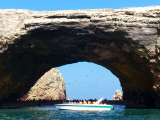 Tourists watching wildlife in Ballestas Islands Reserve in Peru