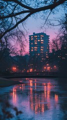 Obraz premium City building reflected in a frozen pond at twilight.