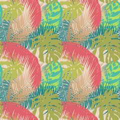 Exotic leaves of tropical trees on a beige background. Summer seamless pattern with palm leaves for fabrics and wallpapers.