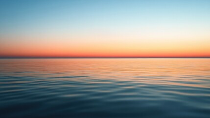 Obraz premium Serene Horizon at Sunset with Calm Ocean Waves Reflecting Gradient Sky Colors in Gold, Pink, and Blue Tones