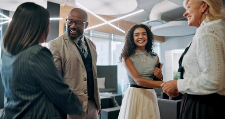 Collaboration, handshake and meeting with business people in lobby of office for greeting or welcome. Conversation, discussion and teamwork with corporate employee group shaking hands in workplace