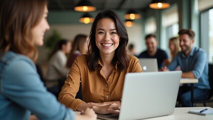 Posed in a modern coworking space, a businesswoman and her diverse team work together, cultivating a strong sense of collaboration and unity.
