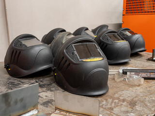 Metalworking: a welding mask on a workbench.