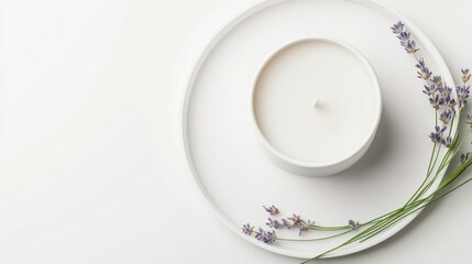 Obraz premium Serene white candle on a minimalist tray, adorned with delicate lavender sprigs. A calming and peaceful scene.