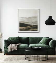 Foggy mountain landscape art print above green velvet sofa in modern living room.