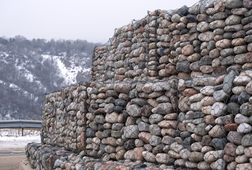 Gabion wall, built to protect the road from landslides from natural stones and wire