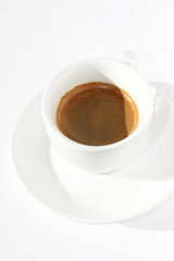 Coffee. Espresso. Closeup of Cup of Freshly Brewed Espresso on White Background.