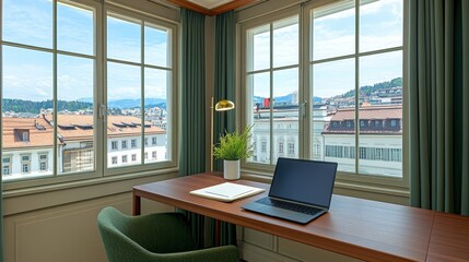 Desk with laptop overlooking city through window with cityscape background