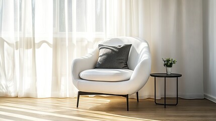 Cozy reading nook with a white armchair and a black side table against a light wall.