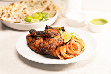 Grilled/ charcoal/ fried chicken with mayo dip and salad served in dish isolated on table top 