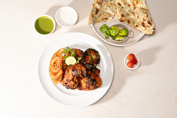Grilled/ charcoal/ fried chicken with mayo dip and salad served in dish isolated on table top 