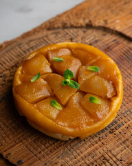 Pear tart tatin made with a traditional French recipe in a Paris restaurant.