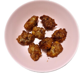 Minced pork deep fried beef with garlic in pink bowl, fried pork ball isolated on white background